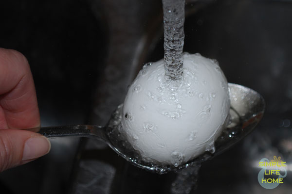 Running egg under cold water